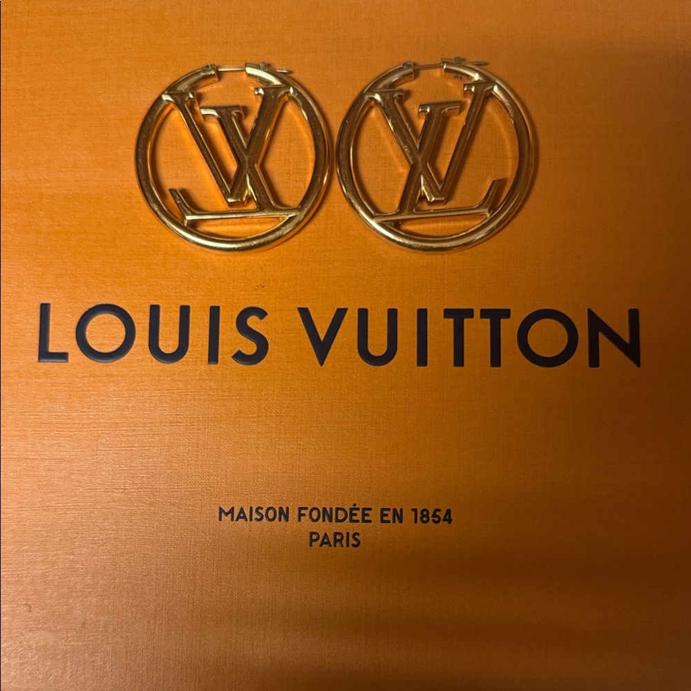 Genuine Louis Vuitton Gold Circle LV Logo Earrings.